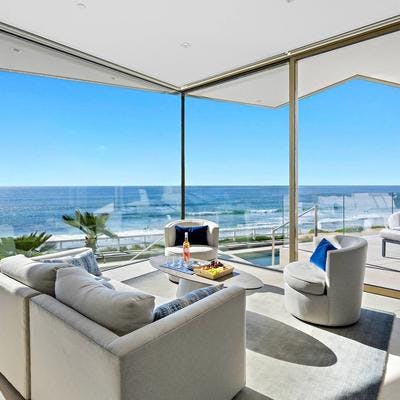 Living space with ocean views at a Bluewater Vacation Homes rental property.