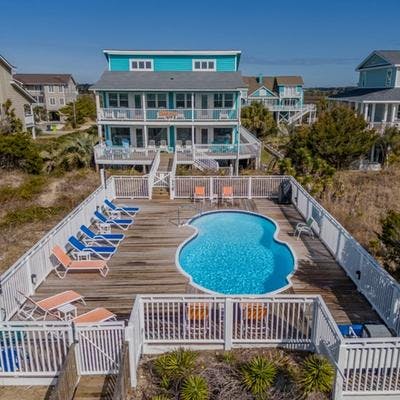 Exterior view of a Holden Beach vacation rental with a private pool.