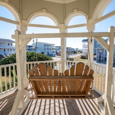 Porch swing at a Holden Beach vacation rental.