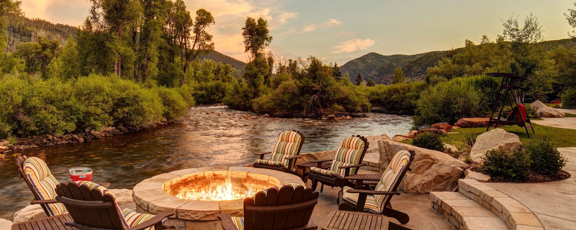 Riverside outdoor living space in a Park City vacation rental.