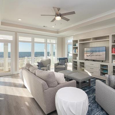 Living room with an ocean view at a Holden Beach vacation rental.
