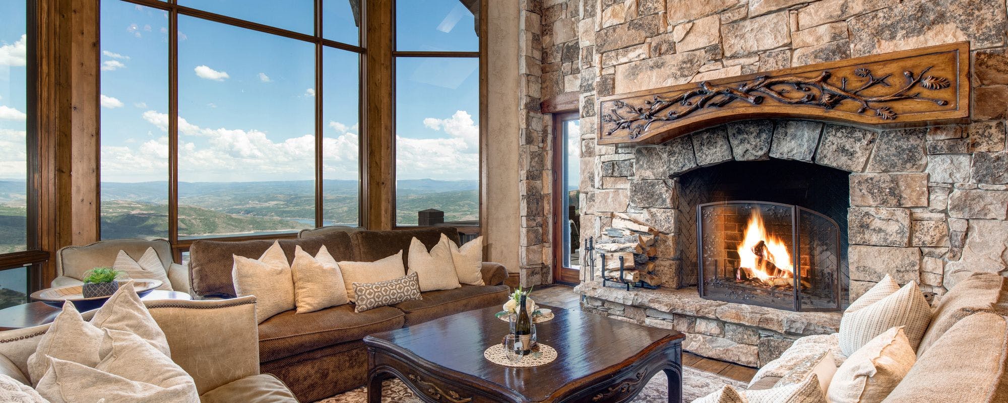 Comfy living space with working fireplace in a Park City vacation rental.