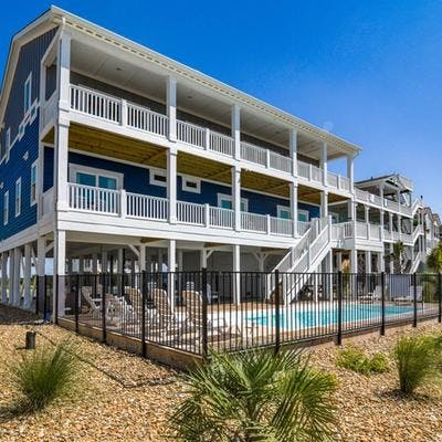 Exterior view of a Holden Beach vacation rental with a private pool.