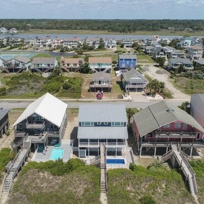Aerial view of an oceanfront vacation rental in Holden Beach. 