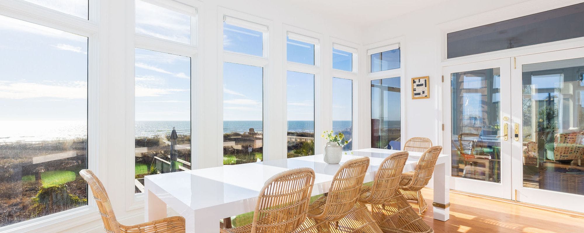 Oceanfront dining room with spectacular views in a Folly Beach vacation rental home.