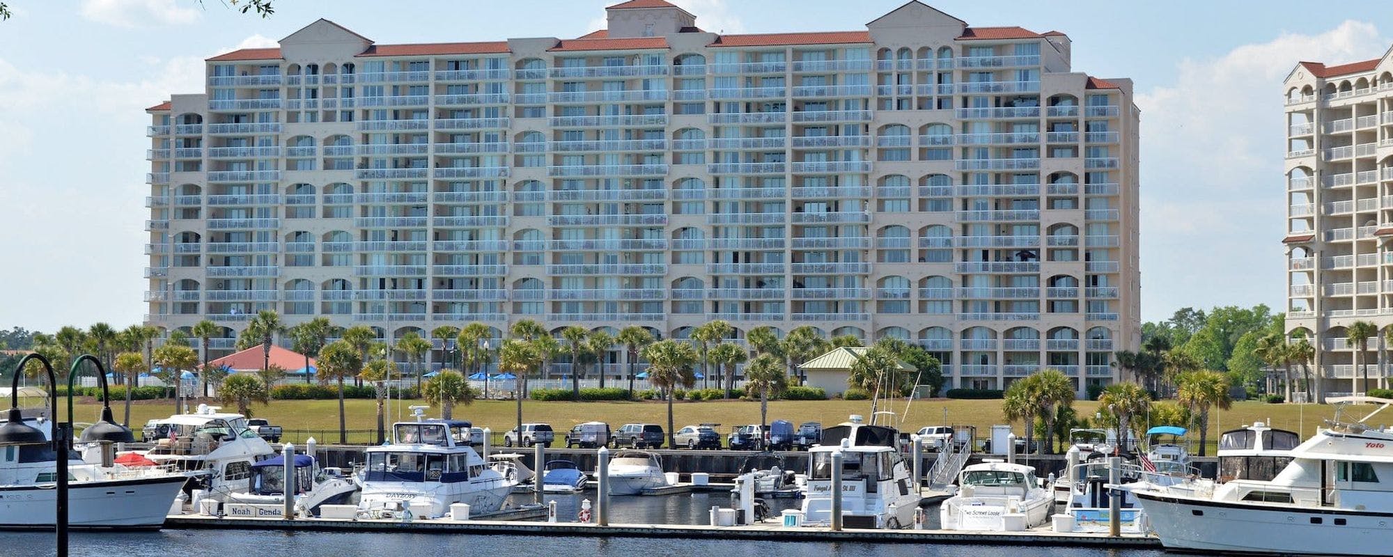 Exterior of Myrtle Beach condo with boats and jet skis 